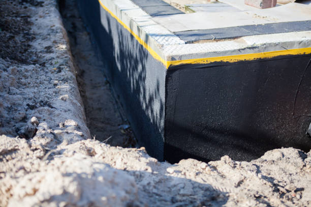 Professional Basement Waterproofing technician working in Mendota, MN